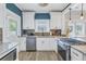 Bright, updated kitchen with white cabinets and stainless steel appliances at 236 9Th Ne Ave, St Petersburg, FL 33701