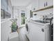 Laundry room with washer, dryer and exterior access at 236 9Th Ne Ave, St Petersburg, FL 33701