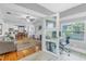 Open living area with home office, hardwood floors, and fireplace at 236 9Th Ne Ave, St Petersburg, FL 33701