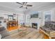Cozy living room with fireplace and view into dining area at 236 9Th Ne Ave, St Petersburg, FL 33701