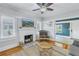 Living room with fireplace and view into adjacent home office at 236 9Th Ne Ave, St Petersburg, FL 33701