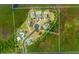 Aerial view of a residential area with several houses and pools at 3040 Sheppards Crook Ct, Holiday, FL 34691