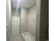 Clean bathroom featuring a shower/tub combo and tile surround at 3040 Sheppards Crook Ct, Holiday, FL 34691