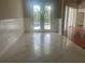 Spacious dining area with tile floors and access to backyard at 3040 Sheppards Crook Ct, Holiday, FL 34691