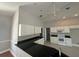 Kitchen boasts black countertops and white cabinets at 3040 Sheppards Crook Ct, Holiday, FL 34691