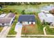 Aerial view of single story home with backyard lake view at 3145 Covina St, New Port Richey, FL 34655