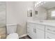 Bathroom with white vanity, quartz countertop and tile shower at 3145 Covina St, New Port Richey, FL 34655