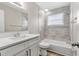 Updated bathroom with white vanity, new tub, and modern tile at 3145 Covina St, New Port Richey, FL 34655