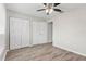 Bedroom with double closets and wood-look flooring at 3145 Covina St, New Port Richey, FL 34655