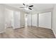 Bedroom with wood-look floors, double closets and en-suite bath at 3145 Covina St, New Port Richey, FL 34655