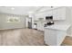 Modern kitchen with white cabinets and stainless steel appliances at 3145 Covina St, New Port Richey, FL 34655