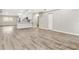 Open concept kitchen features modern white cabinetry and a large island at 3145 Covina St, New Port Richey, FL 34655