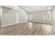 Bright and airy living room with wood-look floors at 3145 Covina St, New Port Richey, FL 34655