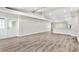 Open living room with high ceilings and wood-look flooring at 3145 Covina St, New Port Richey, FL 34655