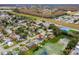 Aerial view of home's location within the neighborhood and nearby lake at 3145 Covina St, New Port Richey, FL 34655