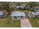 Single-story house, brick driveway, and a large backyard at 3645 Lokai Pl, Sarasota, FL 34232