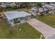 Single story home with a large yard and brick driveway at 3645 Lokai Pl, Sarasota, FL 34232