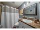Bathroom with white vanity and shower/tub combo at 3645 Lokai Pl, Sarasota, FL 34232