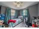Cozy bedroom with twin bed, desk and window at 3645 Lokai Pl, Sarasota, FL 34232
