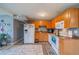 Well-equipped kitchen featuring light wood cabinets and appliances at 3645 Lokai Pl, Sarasota, FL 34232