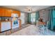 Bright kitchen with wood cabinets, microwave, and eat-in area at 3645 Lokai Pl, Sarasota, FL 34232