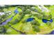 Aerial view of community golf course and ponds at 37318 Lois Ave, Zephyrhills, FL 33542
