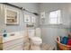 Clean bathroom with toilet, sink, and shower at 37318 Lois Ave, Zephyrhills, FL 33542
