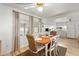 Cozy dining area with a wooden table and four wicker chairs at 37318 Lois Ave, Zephyrhills, FL 33542