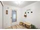 Bright entryway with a bench and storage at 37318 Lois Ave, Zephyrhills, FL 33542