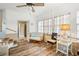 Sunroom with comfy seating and access to bathroom at 37318 Lois Ave, Zephyrhills, FL 33542