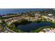 Aerial view of waterfront community with pool and lush landscaping at 4550 Overlook Ne Dr # 258, St Petersburg, FL 33703