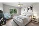 Second bedroom with a queen-size bed and a sitting chair at 4550 Overlook Ne Dr # 258, St Petersburg, FL 33703