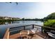 Relaxing waterfront dock with chairs, offering peaceful lake views at 4550 Overlook Ne Dr # 258, St Petersburg, FL 33703