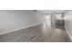Open living area with wood-look floors and view into kitchen at 4550 Overlook Ne Dr # 258, St Petersburg, FL 33703