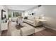 Bright living room featuring a sectional sofa and large windows at 4550 Overlook Ne Dr # 258, St Petersburg, FL 33703