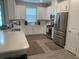 Modern kitchen with stainless steel appliances and white cabinets at 4576 Garofalo Rd, Wesley Chapel, FL 33543