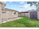 Large backyard with shed and patio area at 5135 River Point Ct, New Port Richey, FL 34653