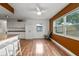 Bright dining area with kitchen access and wood floors at 5135 River Point Ct, New Port Richey, FL 34653