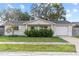 Updated single story home with landscaped lawn and attached garage at 5135 River Point Ct, New Port Richey, FL 34653