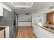 Kitchen boasts granite countertops and white cabinets at 5135 River Point Ct, New Port Richey, FL 34653