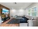 Spacious living room featuring an L-shaped sectional sofa at 5135 River Point Ct, New Port Richey, FL 34653