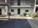 Condo building exterior with parking and landscaping at 5197 Silent Loop # 121, New Port Richey, FL 34652