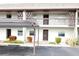 Condo building exterior showcasing parking and entrance at 5197 Silent Loop # 121, New Port Richey, FL 34652