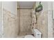Updated tan tiled shower and toilet at 5265 Venetian Ne Blvd, St Petersburg, FL 33703