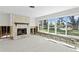 Spacious living room with a stone fireplace undergoing renovation at 5265 Venetian Ne Blvd, St Petersburg, FL 33703