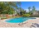 Inviting kidney-shaped pool with brick pavers at 5265 Venetian Ne Blvd, St Petersburg, FL 33703