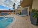 Hot tub area with tiled patio and surrounding landscaping at 555 5Th Ne Ave # 521, St Petersburg, FL 33701