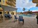 Relaxing pool area with pergola, lounge chairs, and patio furniture at 555 5Th Ne Ave # 521, St Petersburg, FL 33701