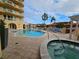 Community pool and hot tub with plenty of patio seating at 555 5Th Ne Ave # 521, St Petersburg, FL 33701