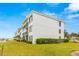 Building exterior showcasing landscaping and waterfront location at 6287 Bahia Del Mar Cir # 208, St Petersburg, FL 33715